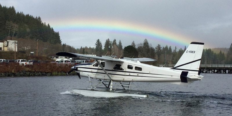 Seaplane with a rainbow in the background
